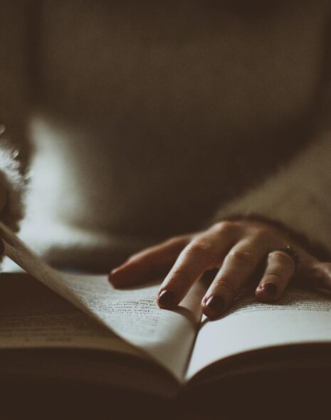 photo of person flipping book page